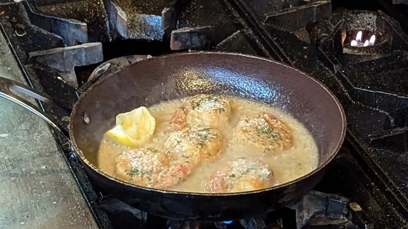 Chicken piccata pan-seared in the Campanale's kitchen